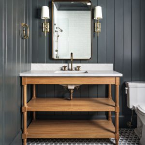 Vanity cabinets don’t have to be built-ins. Free-standing, open bathroom cabinets can have open shelving in lieu of closed cabinets. They also can feature furniture-style details.