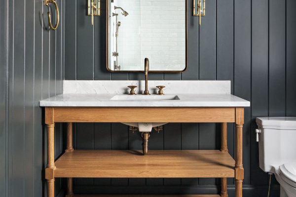 Vanity cabinets don’t have to be built-ins. Free-standing, open bathroom cabinets can have open shelving in lieu of closed cabinets. They also can feature furniture-style details.