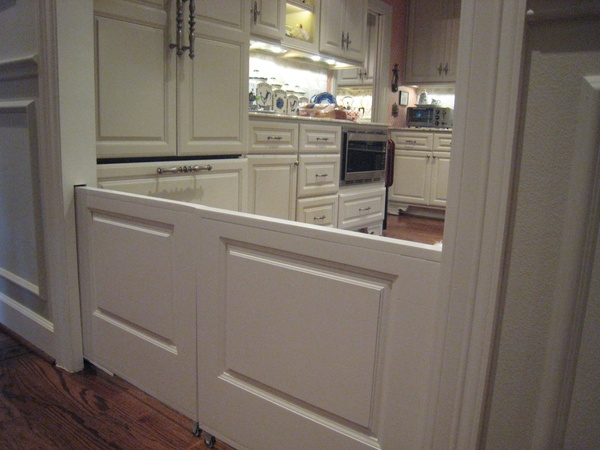 Ban removable doggy doors from your kitchen entryways. Install hidden pocket doors that can keep your furry loved ones in or out as well as any knee-high babies from toddling where they shouldn’t be
