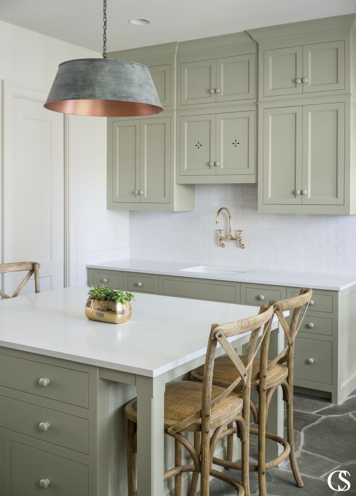 Pastel, muted, even lighter grey-toned greens are good choices for cabinet colors—think sage or mint. They can still make a statement, but will also have longevity in your home. This is one of our favorite green paints on these unique custom cabinets.