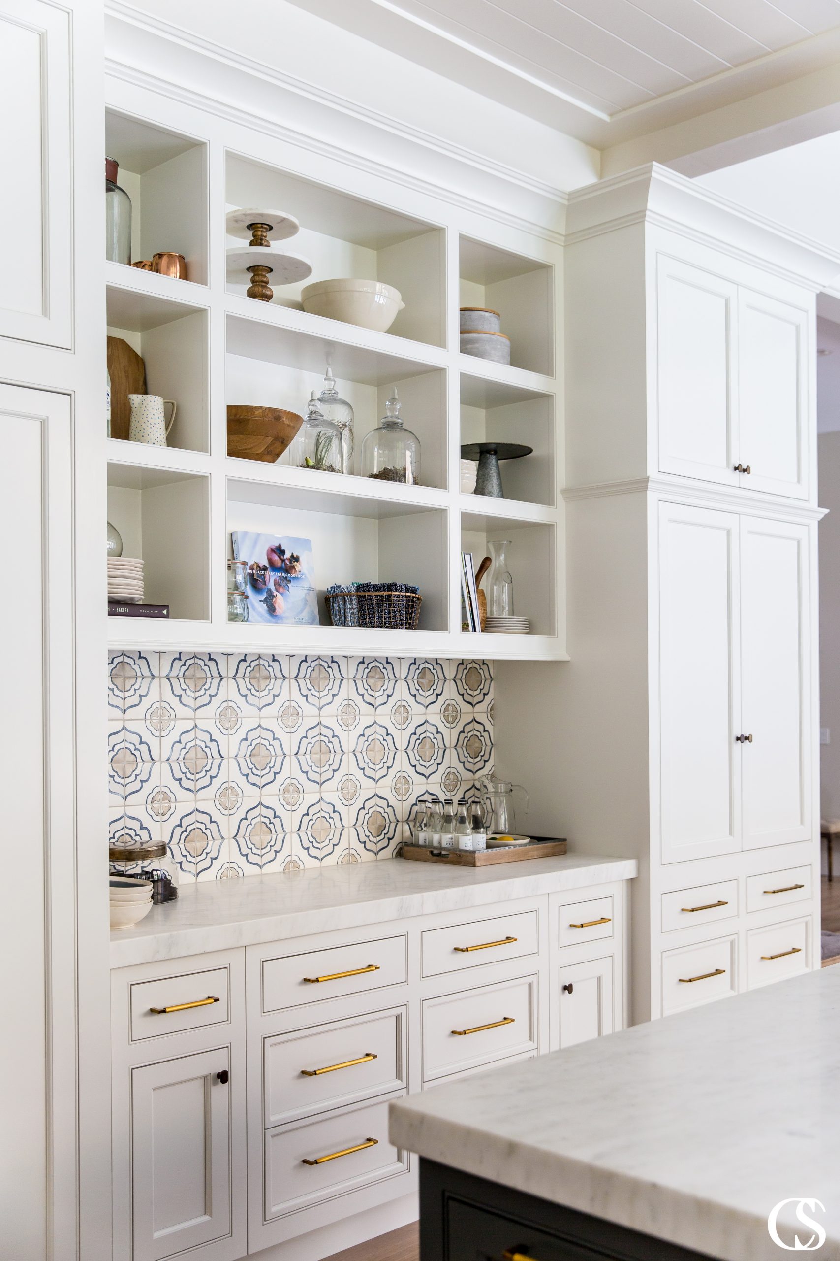 Not every item in your kitchen should be tucked away behind closed doors! Think about which items you'd love to display and design unique custom cabinets around them.