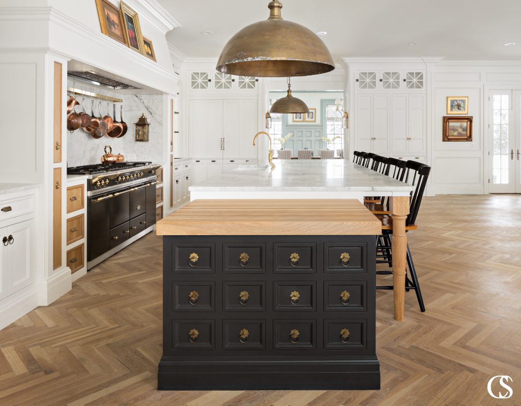 A kitchen island can have a powerful impact on your home. This unique kitchen island design combines multiple colors, materials, and global influence to reflect a beautifully eclectic style.