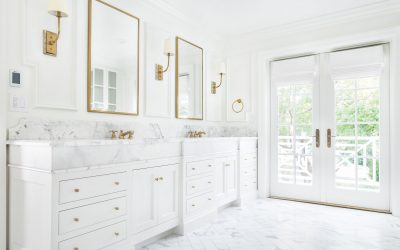 White inset cabinetry with white marble countertops, white herringbone floors, and white paint ensure that this white custom bathroom design excludes luxury.