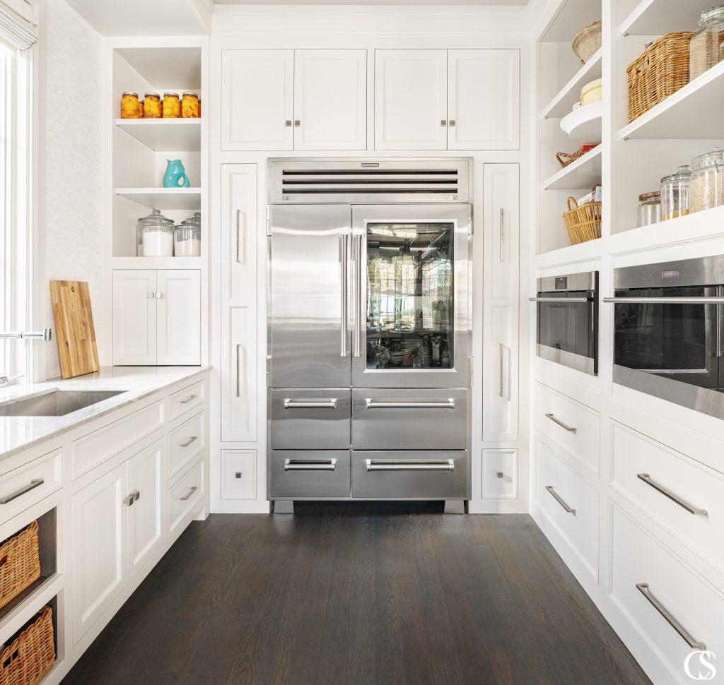 What would you store in the custom kitchen cabinets that surround the refrigerator??