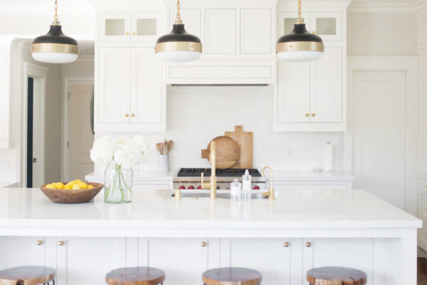 You almost have to play “eye spy” to spot the custom oven hood in this kitchen.