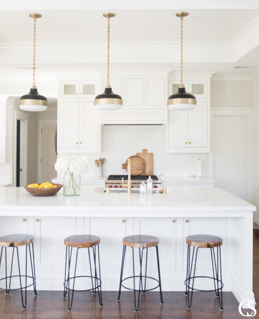 You almost have to play “eye spy” to spot the custom oven hood in this kitchen.