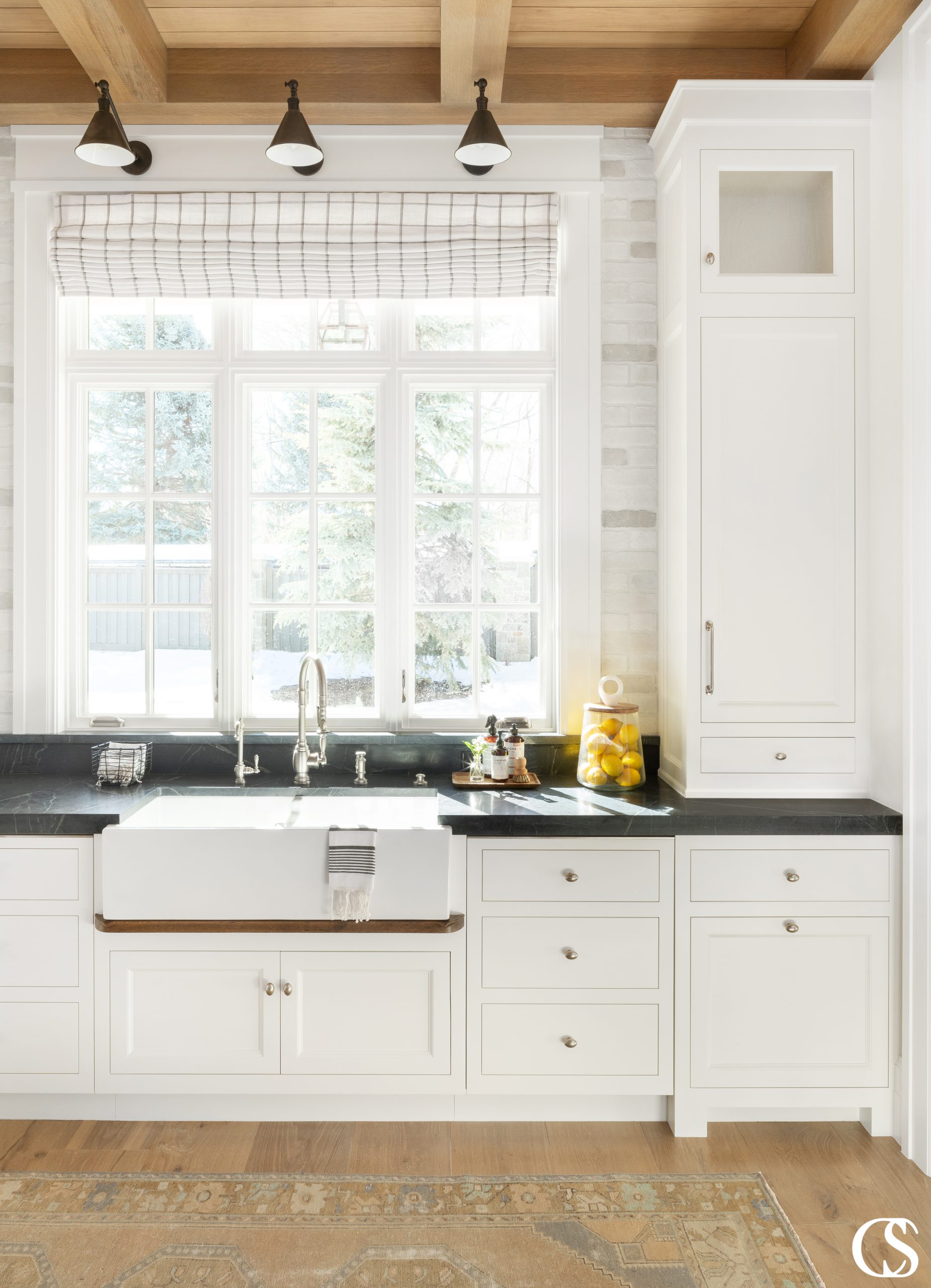 Love how this big kitchen window sheds plenty of light on the custom kitchen cabinet design. And with the addition of the beautiful installed lighting, these inset cabinets will be on display no matter the time of day.
